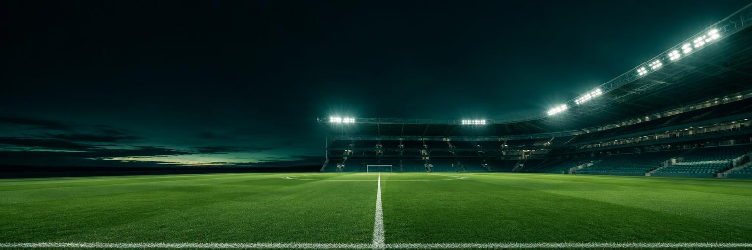 Floodlit football stadium and pitch